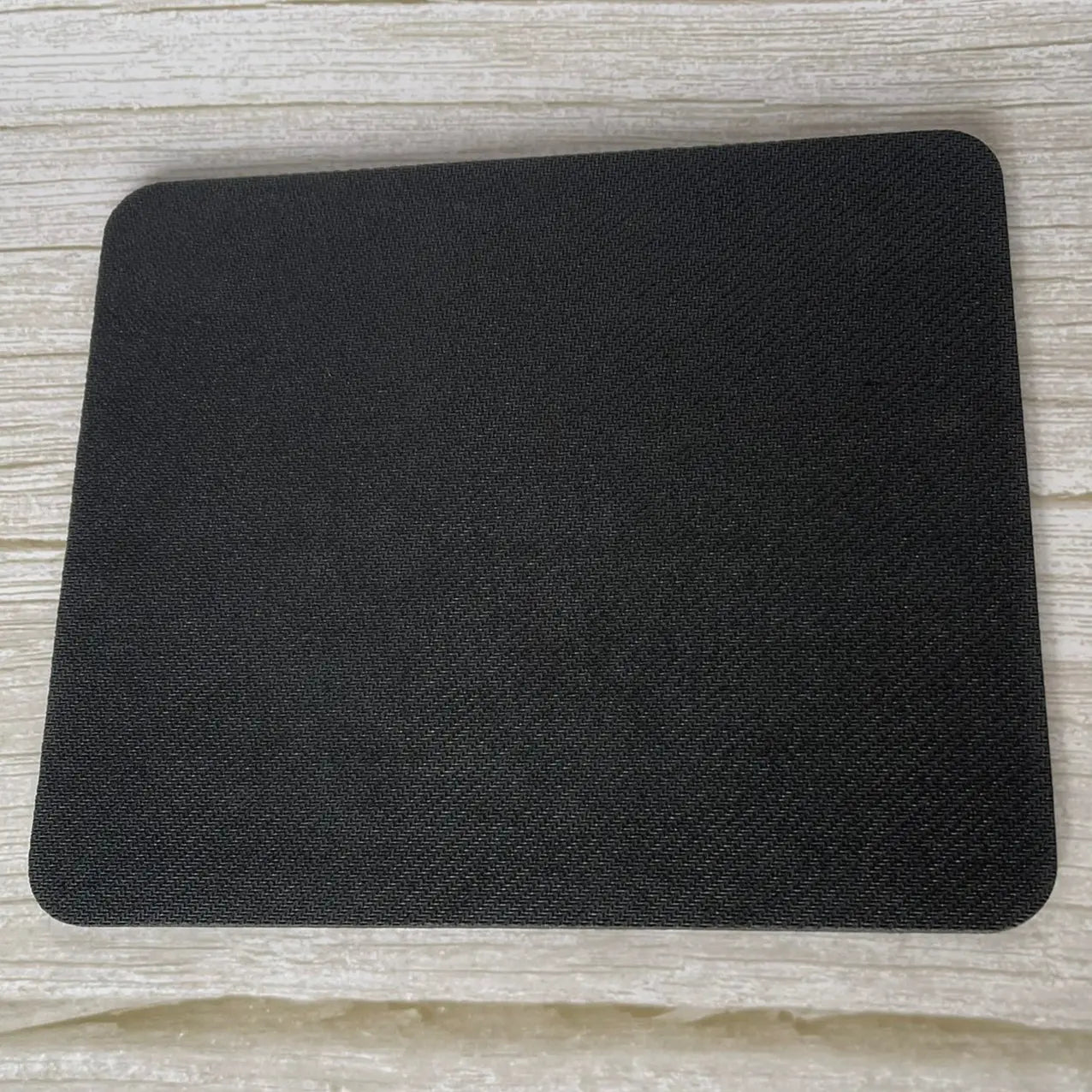 Base en caoutchouc noir antidérapant pour stabilité tapis de souris bureau